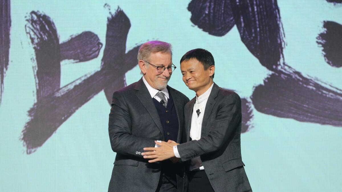 Steven Spielberg joins Alibaba Group's Jack Ma at a press event in Beijing.