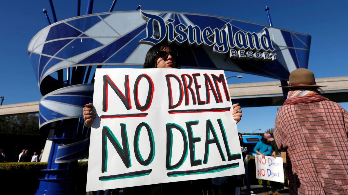 Supporters of the Deferred Action for Childhood Arrivals program rally at an entrance to the Disneyland Resort in Anaheim on Jan. 22.