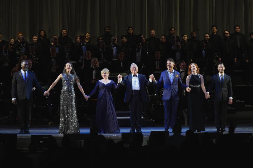 The cast of " Everybody Rise! A Sondheim Celebration" with conductor Kevin Stites (center).