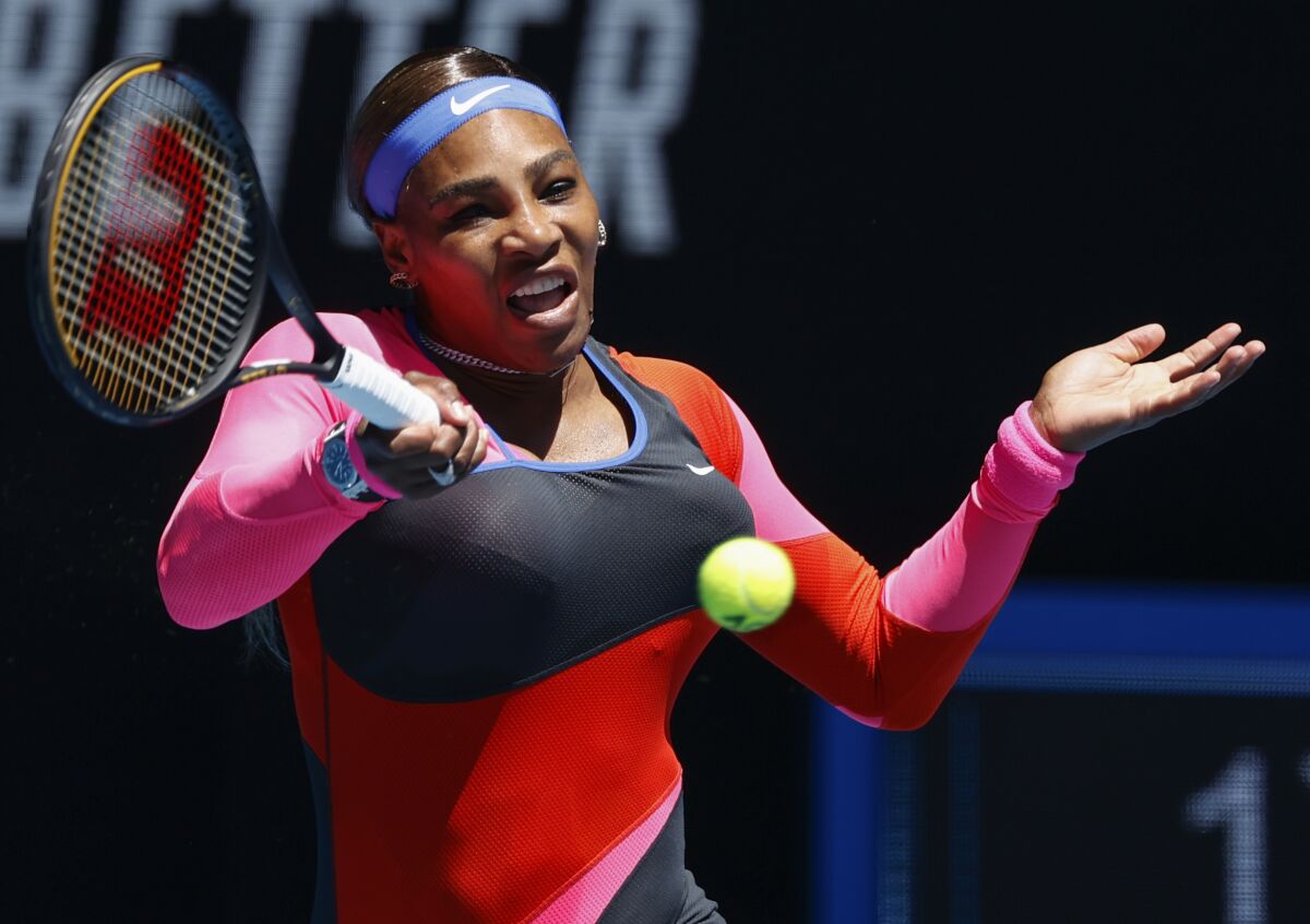 Serena Williams makes a forehand return to Nina Stojanovic.