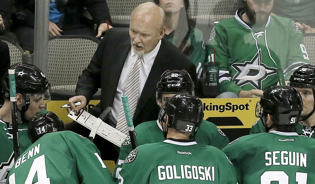 Stars Coach Lindy Ruff talks to his players during a timeout in a regular-season game against the Columbus Blue Jackets.