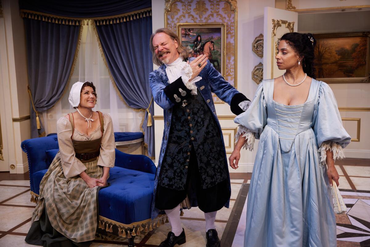 Three actors in a drawing room for Moliere's "Tartuffe."