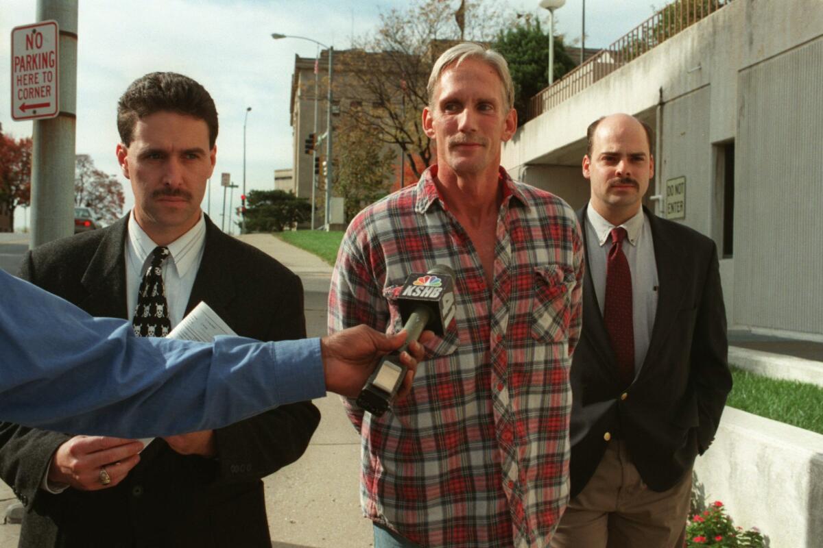 Wesley Ira Purkey is escorted by police officers in Kansas City, Kan., after his arrest in 1998.