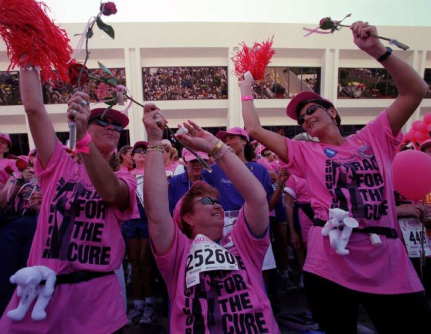 Before the fall: Participants in Newport Beach celebrate at the finish line of a Komen Race for the Cure in 2000.