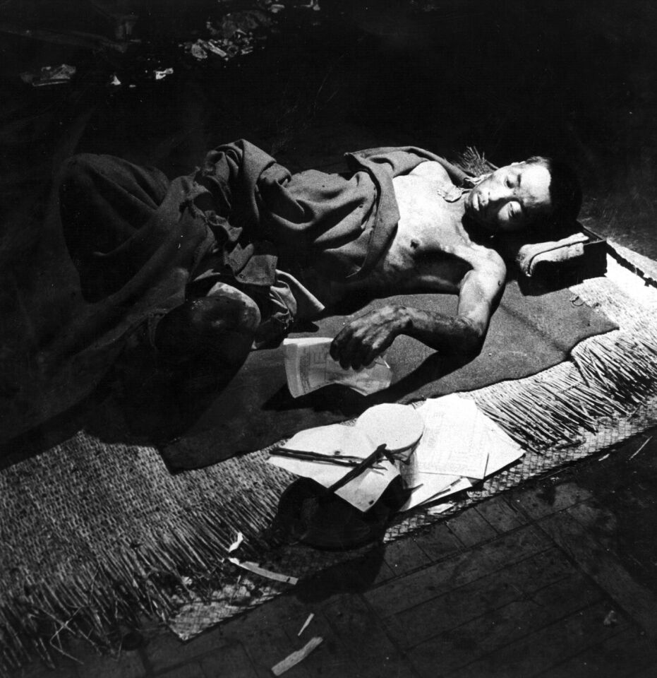 A victim of the atomic bomb blast over Hiroshima, in a makeshift hospital in a bank building. Miller made some of the very first photos in Hiroshima after the bombing.