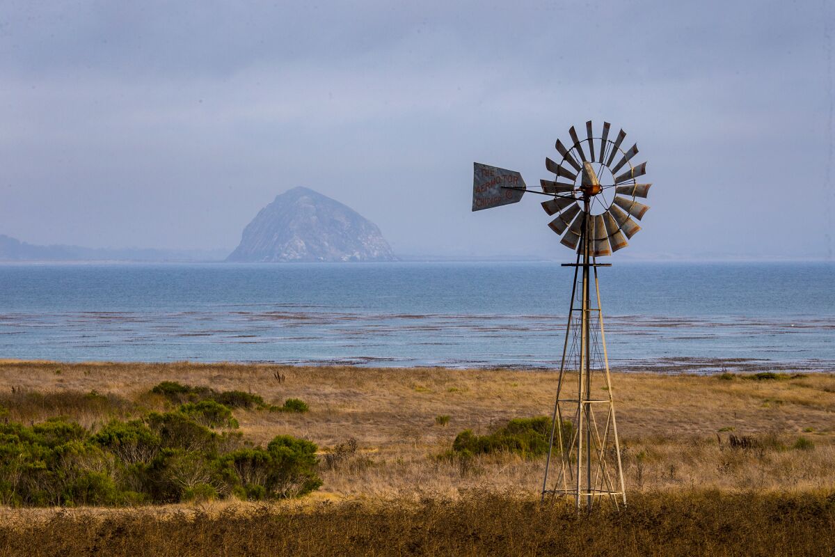 A windmill with Morro Rock in the background. 