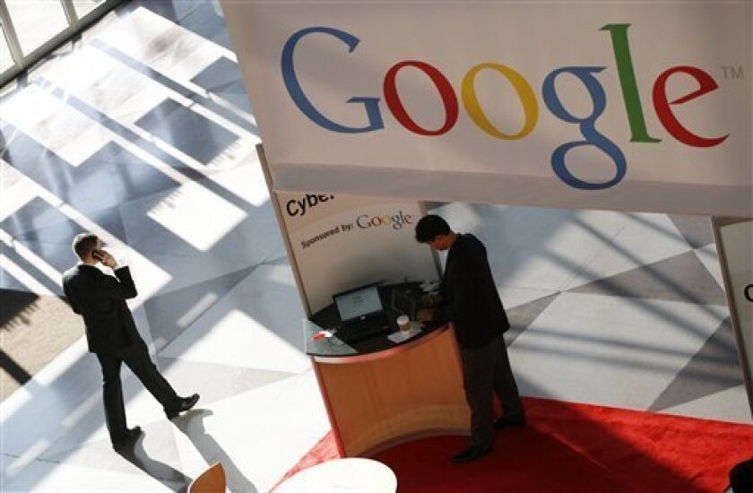 FILE - In this file photo made Jan. 11, 2010, a Google logo is displayed at the National Retail Federation convention in New York. Google Inc. will continue to provide the search results on AOL Inc.'s websites under a new, five-year deal the companies signed this week. (AP Photo/Mark Lennihan, file)