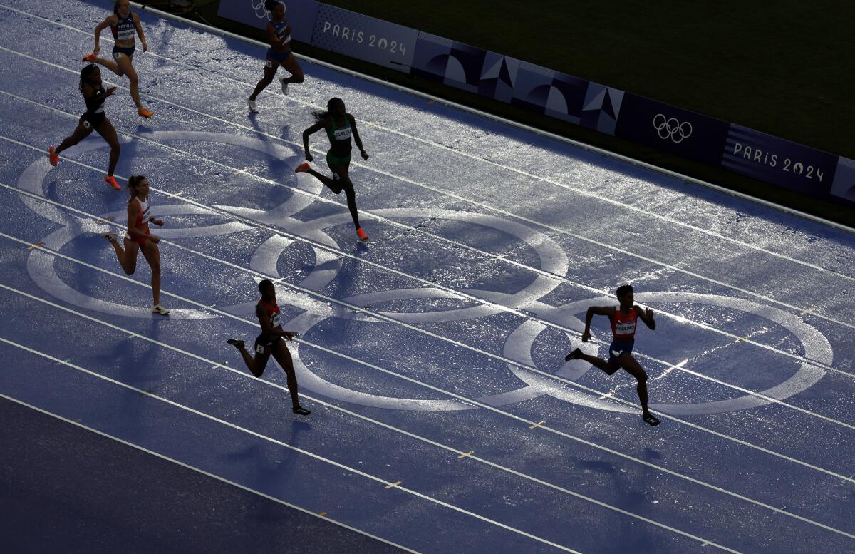 Women compete in the 400-meter final at the 2024 Paris Olympics on Friday.