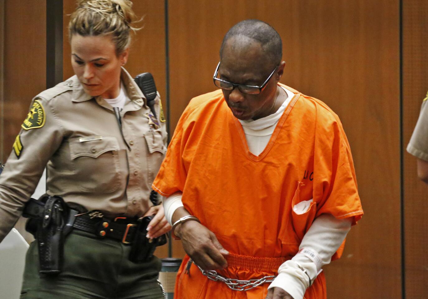 Lonnie David Franklin Jr., the man known as the "Grim Sleeper" serial killer, arrives in a downtown Los Angeles courtroom Wednesday. Franklin was sentenced to death for the slayings of nine women and a teenage girl.