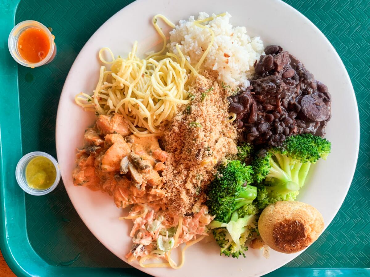 The Pampas Grill buffet has  cold dishes like potato salad and hot  food like garlic rice and the black bean stew feijoada.