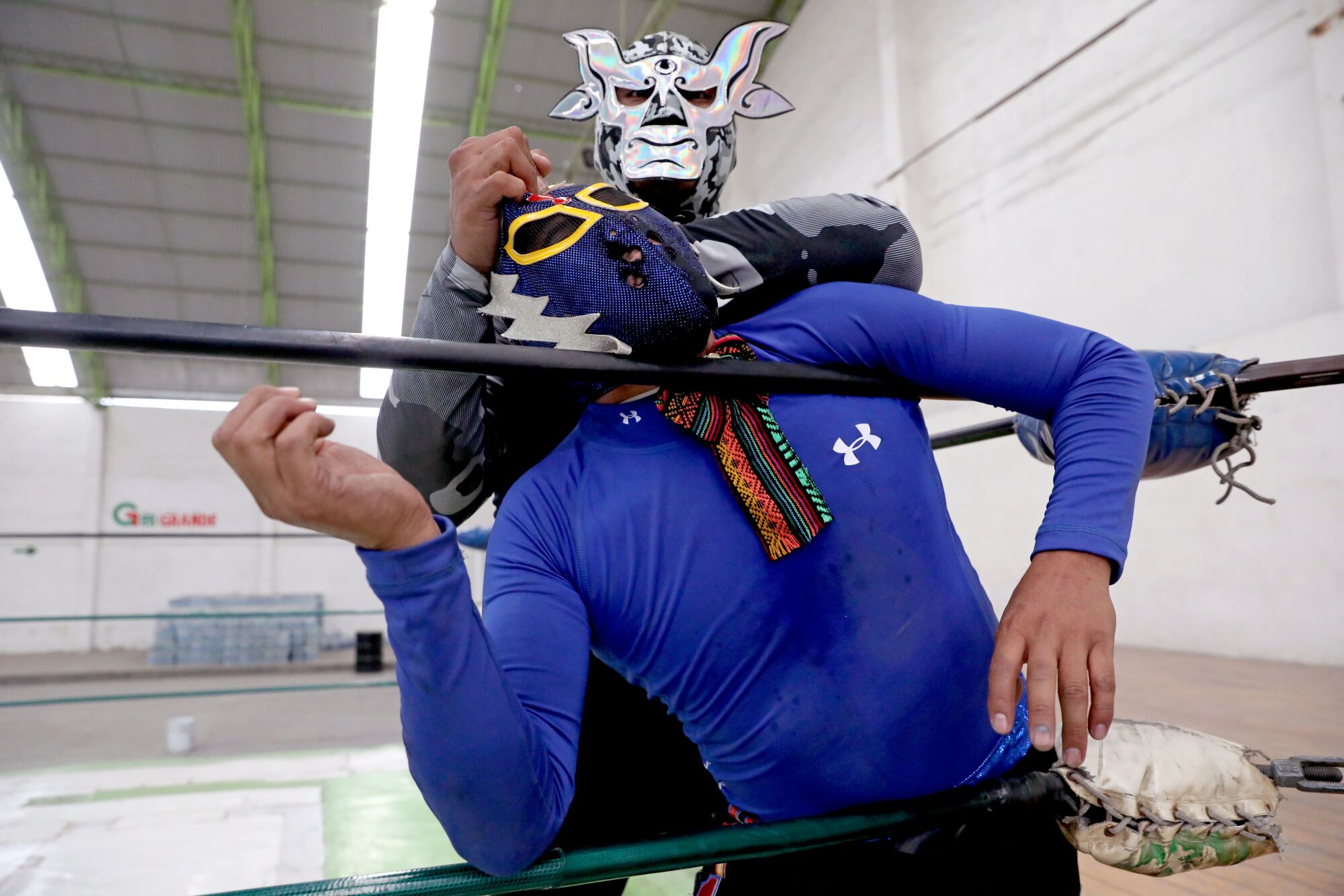 Wrestler Gran Toro has Stigma on the ropes at a lucha libre event that was broadcast online. 