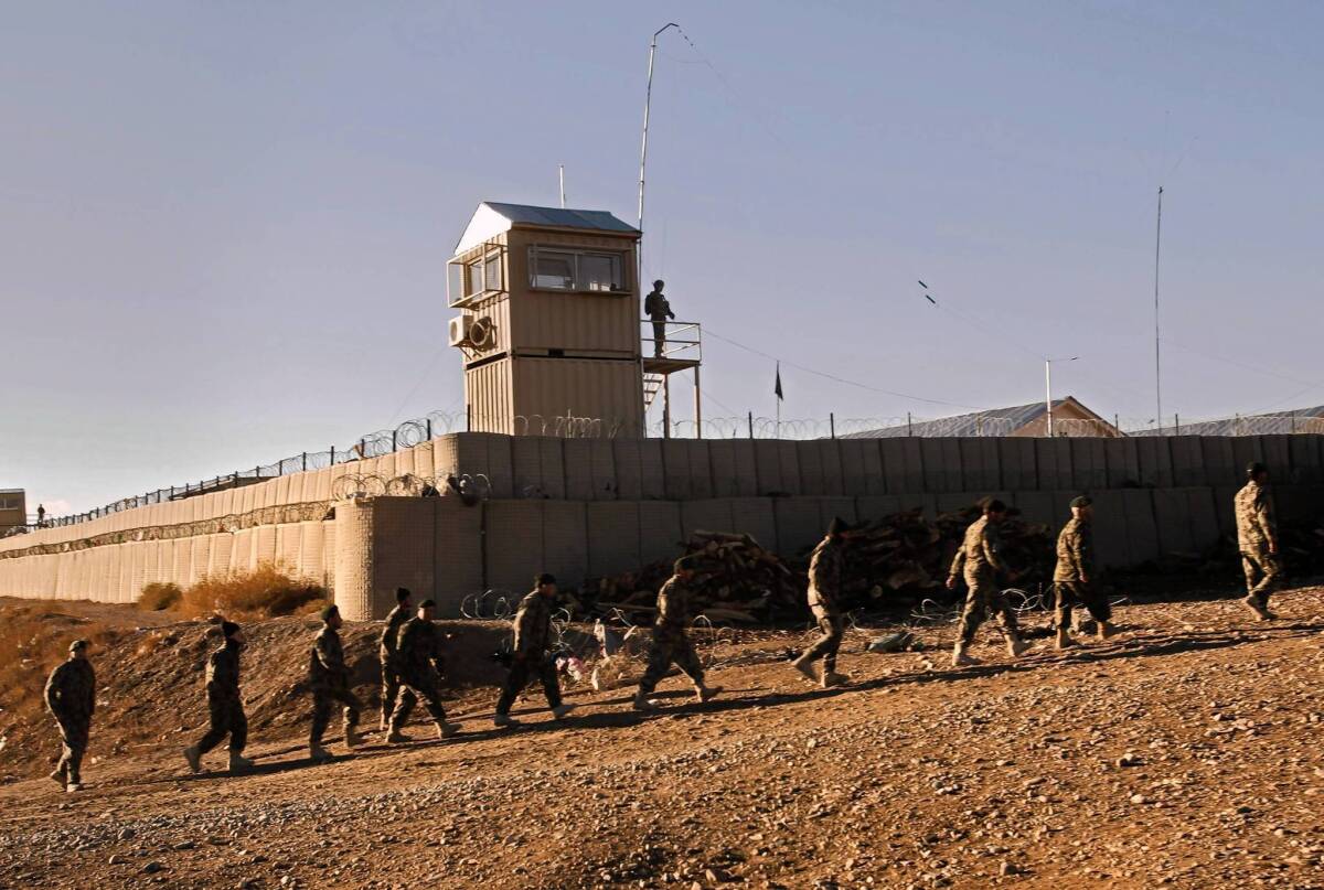 Forward Operating Base Naghlu, in Surobi, Afghanistan, is one of hundreds of bases, checkpoints, guard towers and other outposts the U.S.-led coalition must either dismantle or hand over to Afghan forces. Afghan officials have objected to U.S. decisions to raze some bases.