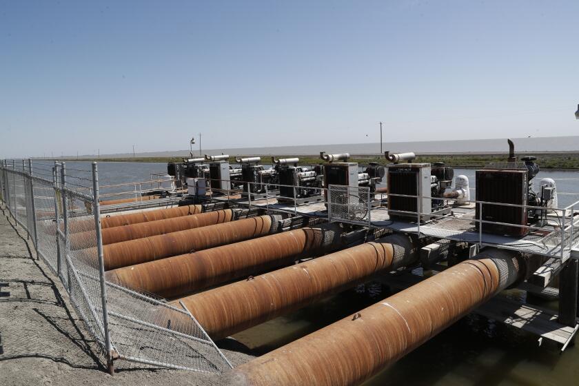 Stratford, CA, Thursday, May 11, 2023 - Pumping station that removes water from the South Fork of the King's River into the North Central Reclamation District, a property owned by Boswell. (Robert Gauthier/Los Angeles Times)