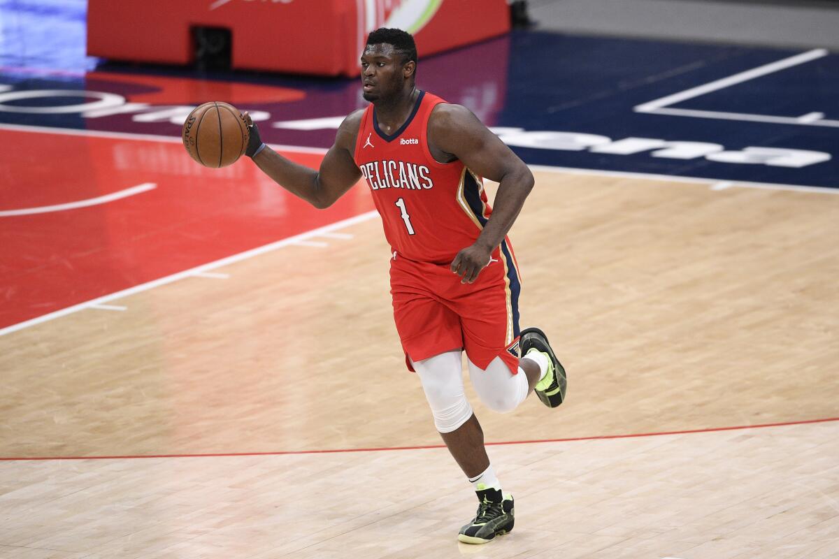 Zion Williamson dribbles the ball during a game against the Washington Wizards.