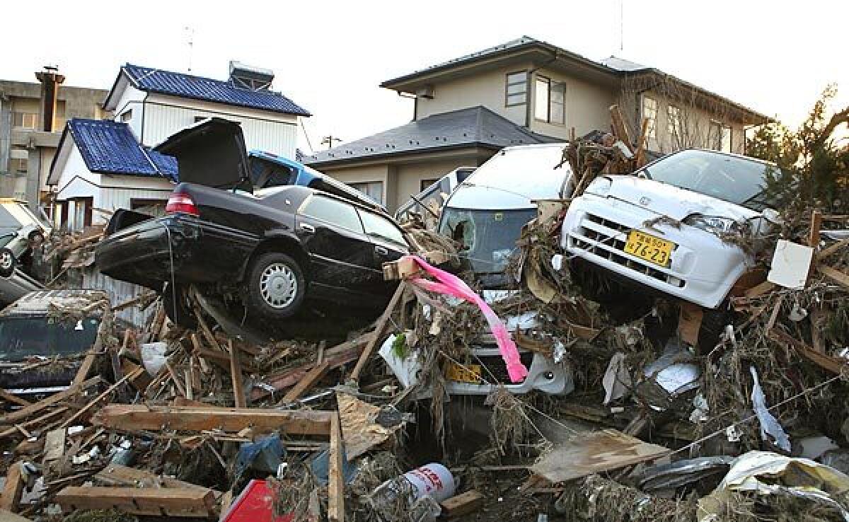 Vehicles and debris litter the Natori neighborhood hit hard by the tsunami.