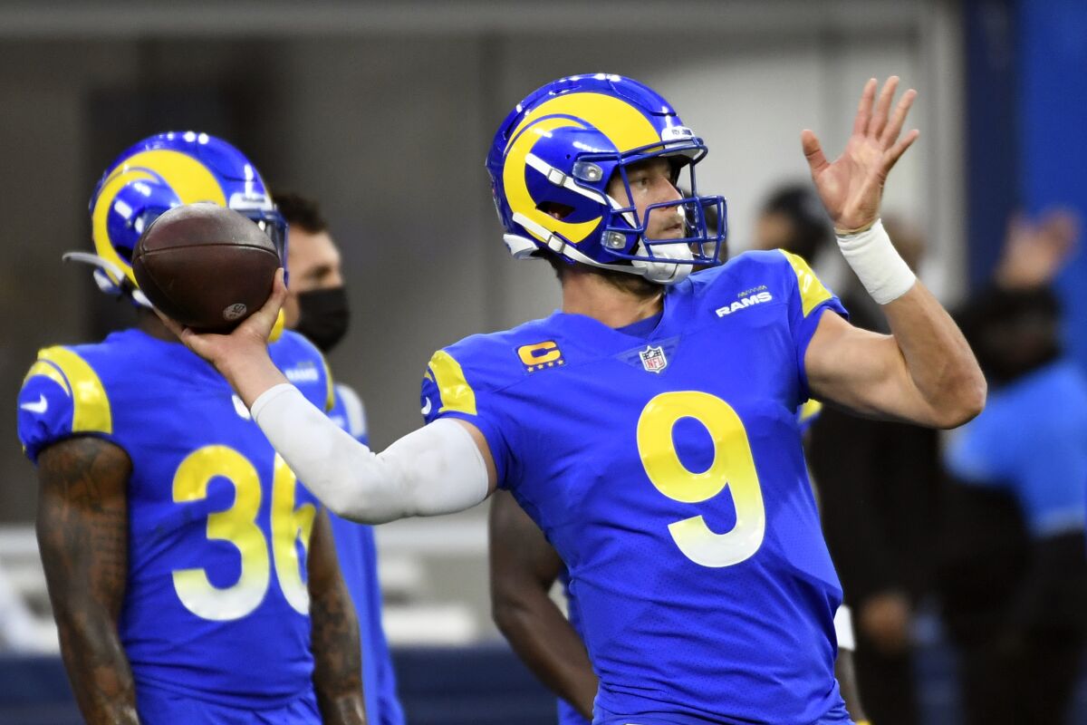 Los Angeles Rams quarterback Matthew Stafford (9) warms up before an NFL football game.