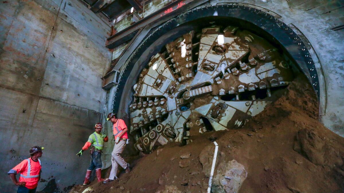"Harriet," a tunnel-boring machine on the Crenshaw/LAX light rail construction project, breaks through at the underground Leimert Park Station.