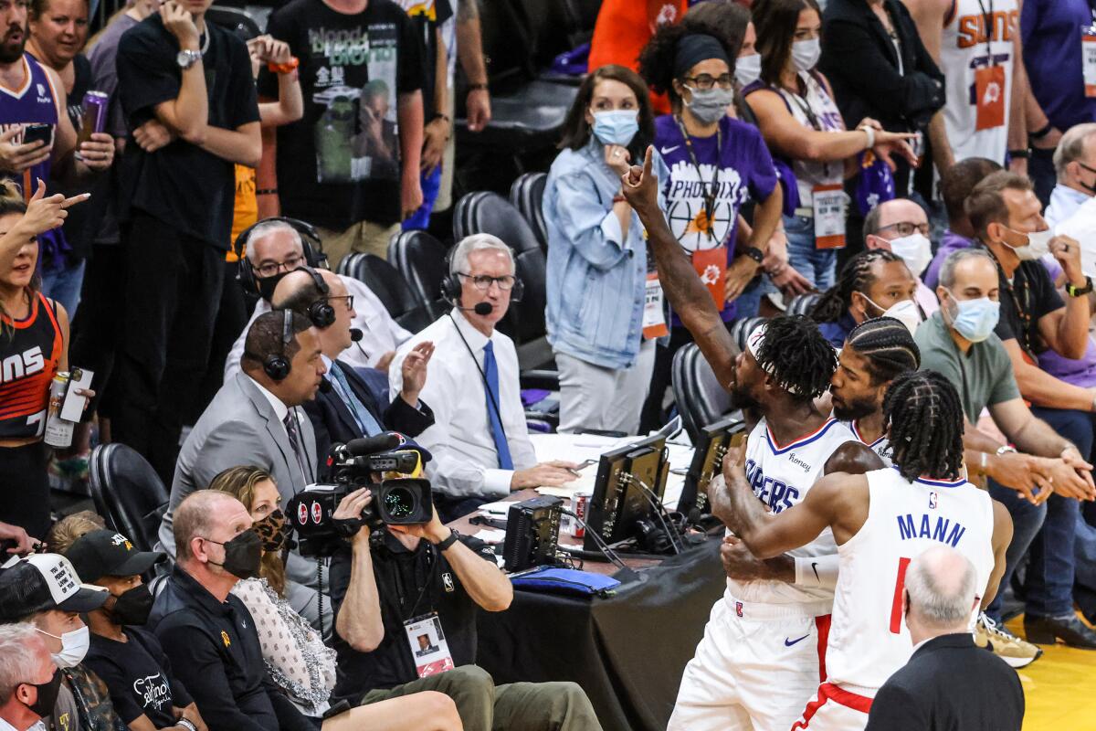 Clippers guard Patrick Beverley taunts fans during Game 2 in Phoenix.
