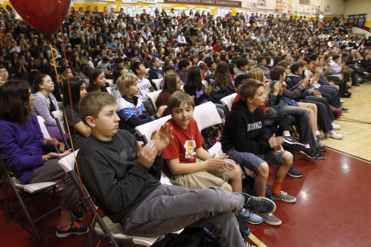 Middle school students listen to speakers as La Cañada High School 7/8 was named a 2014 "Schools to Watch" model middle school, with a banner presented to school representatives at the school's gym in La Cañada Flintridge on Friday, Jan. 31, 2014.