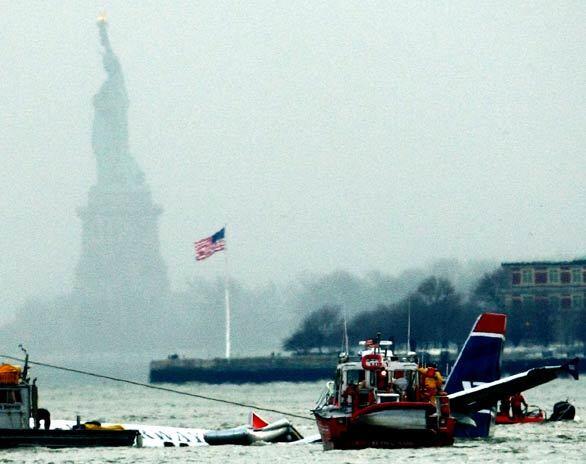 Rescue boats float next to a US Airways plane that made an emergency landing in the Hudson River in New York City. Airbus 320 Flight 1549 crashed shortly after takeoff from LaGuardia Airport about 3 p.m. EST. All of the more than 150 passengers and crew survived.