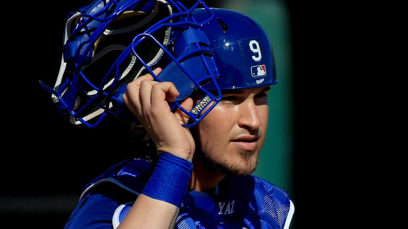 Dodgers catcher Yasmani Grandal takes part in a spring training practice session March 3 in Phoenix.