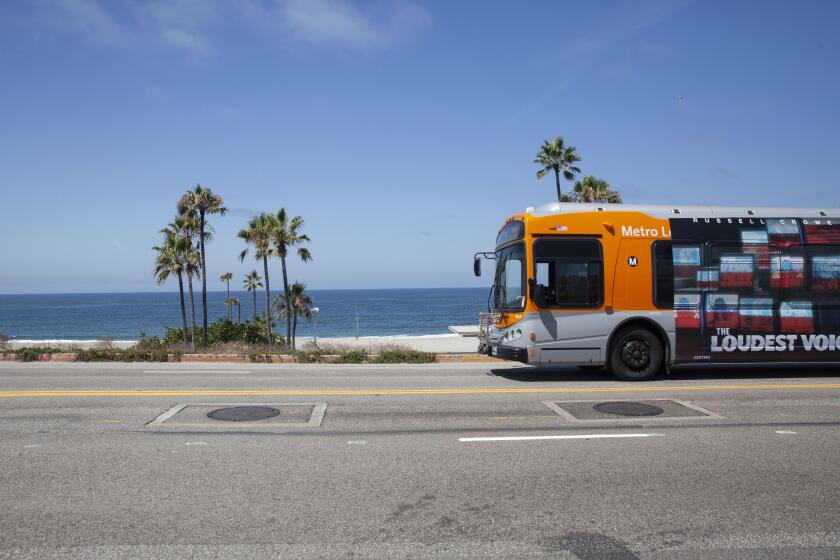 LOS ANGELES, CALIF. - AUGUST 02, 2019: The 115 bus travels along Vista Del Mar on Dockweiler Beach on Friday, Aug. 2, 2019 in Los Angeles, Calif. (Liz Moughon / Los Angeles Times)