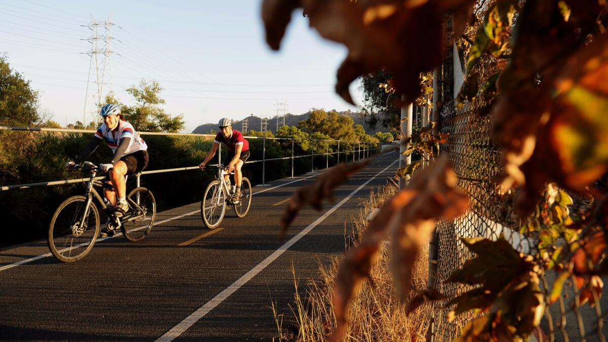 Cyclists enjoy a ride along the Los Angeles River.