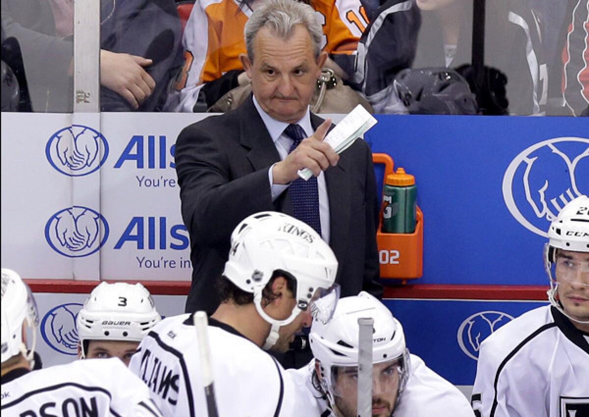 Kings Coach Darryl Sutter talks to his team during a timeout in the second period of a 3-1 loss to the Red Wings on Wednesday night in Detroit.
