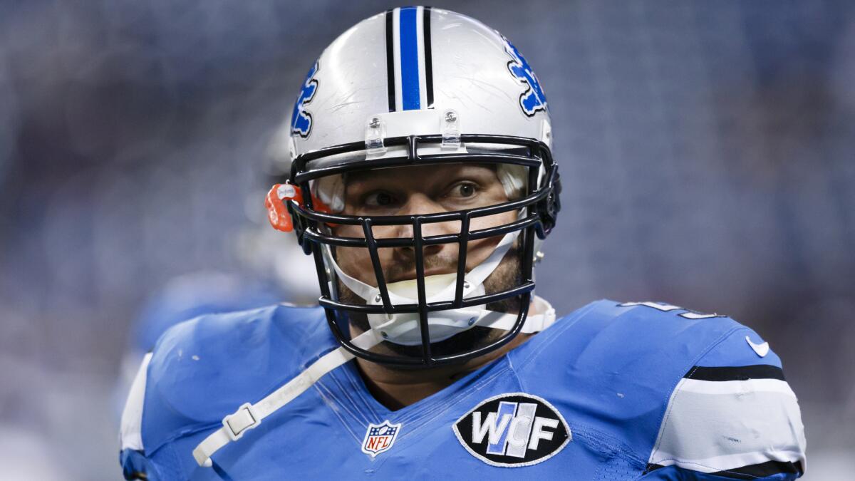 Detroit Lions center Dominic Raiola warms up before a game against the Minnesota Vikings on Dec. 14.