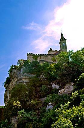 A medieval château perches high on the cliff above Rocamadour, France. Pilgrims have been coming to the town, home of a rare and mystique-shrouded Black Virgin, for centuries.