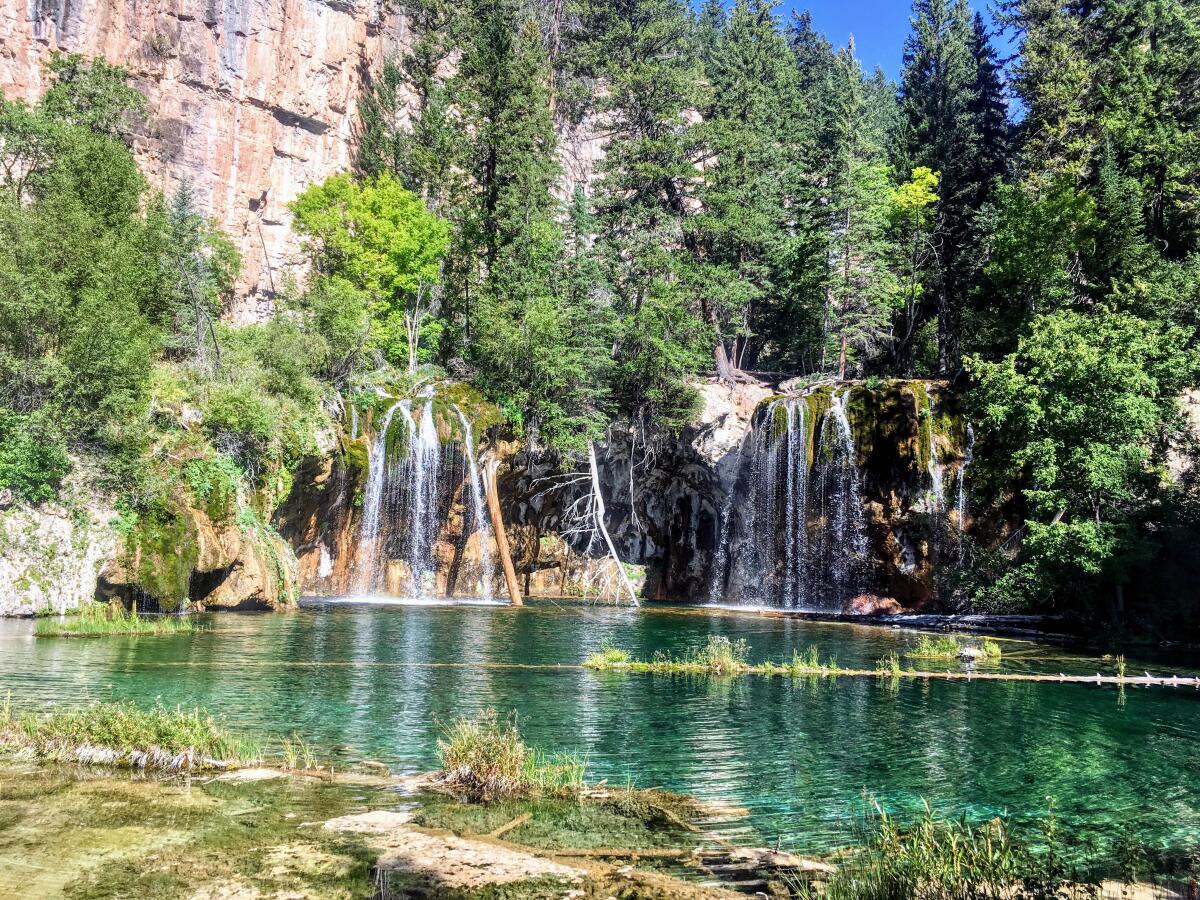 Falls spill into Hanging Lake , reached by Hanging Lake Trail in White River National Forest.