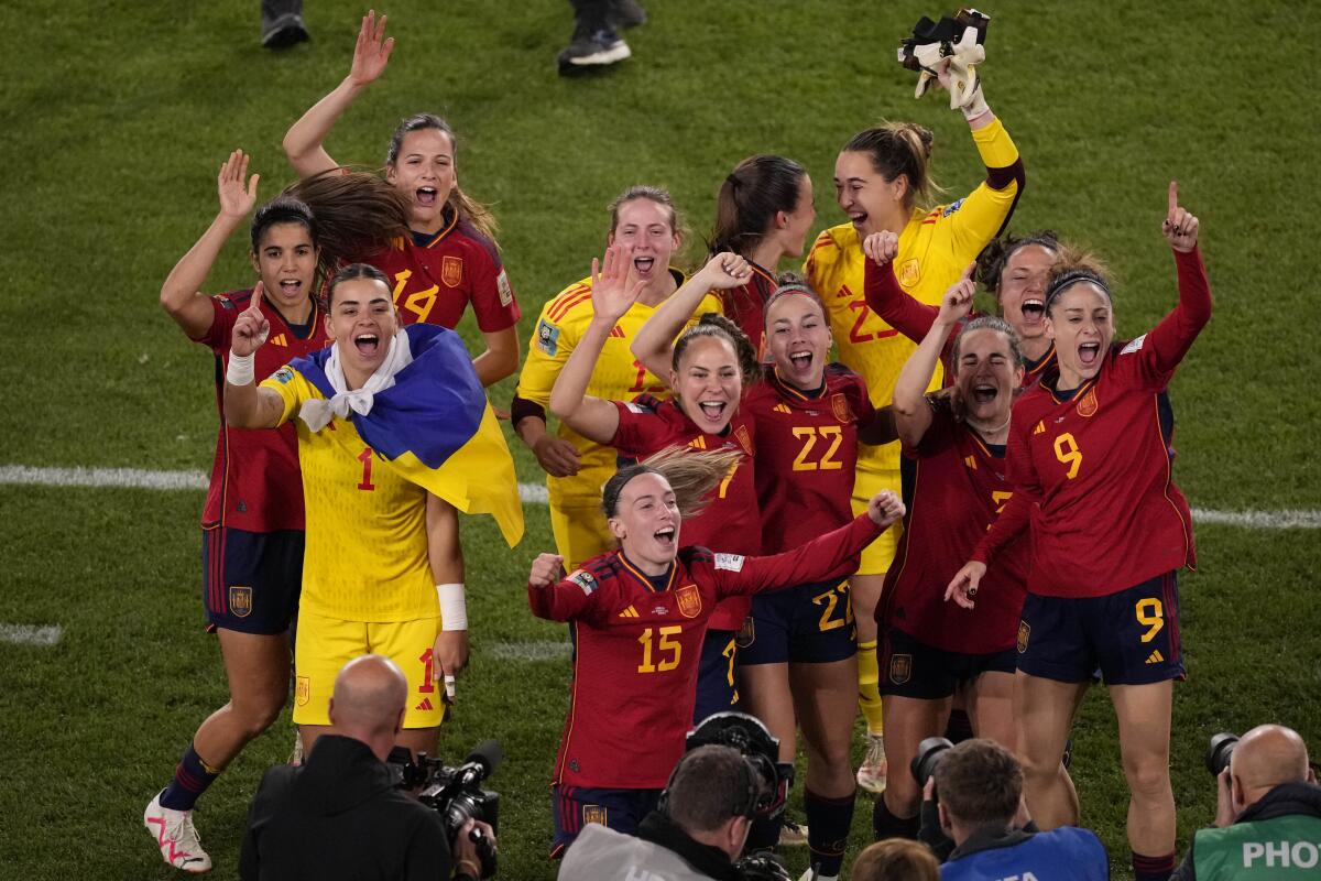 Spain's players celebrate after defeating England to win the women's World Cup final 