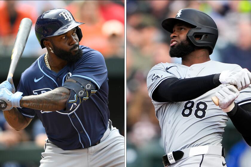Tampa Bay Rays outfielder Randy Arozarena, left, and Chicago White Sox outfielder Luis Robert Jr. side by side.