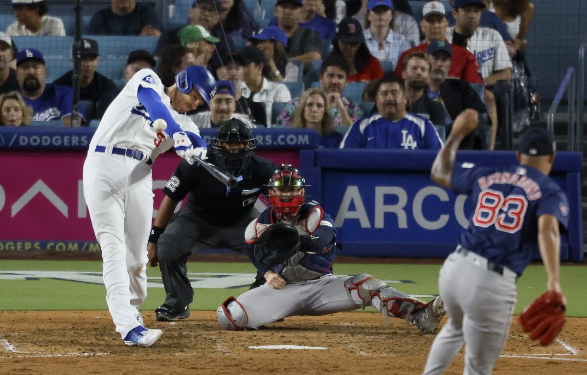 Freddie Freeman hits a grand slam during the eighth inning of the Dodgers' 4-1 win over the Boston Red Sox.