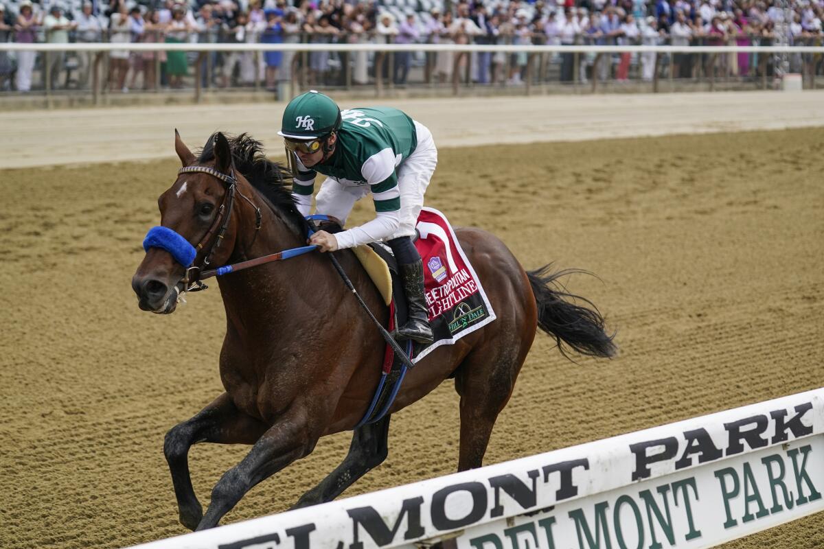 Flightline, with jockey Flavien Prat aboard, wins the Hill 'N' Dale Metropolitan.