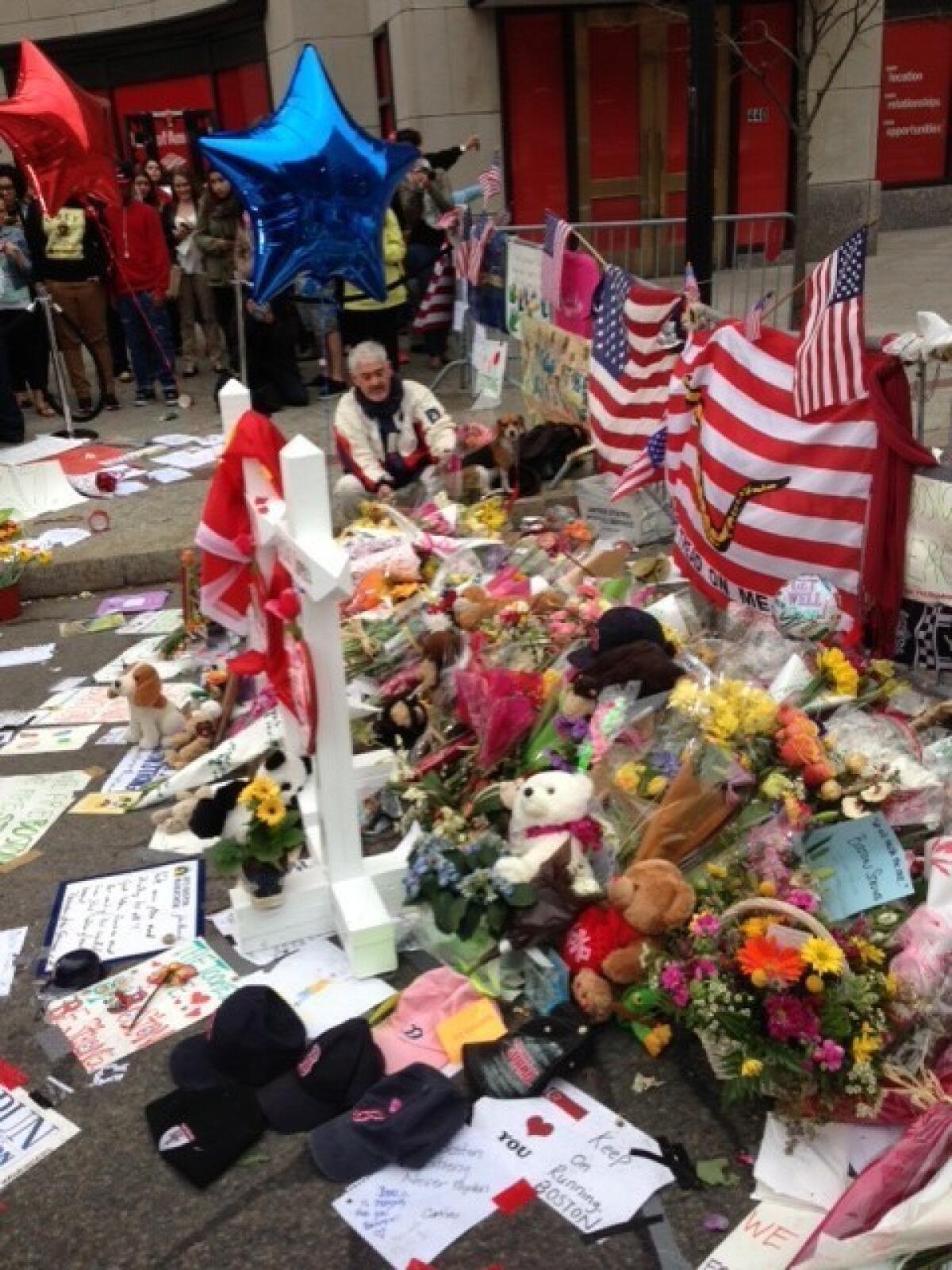 In Boston, a memorial for victims of the marathon bombings continues to grow.
