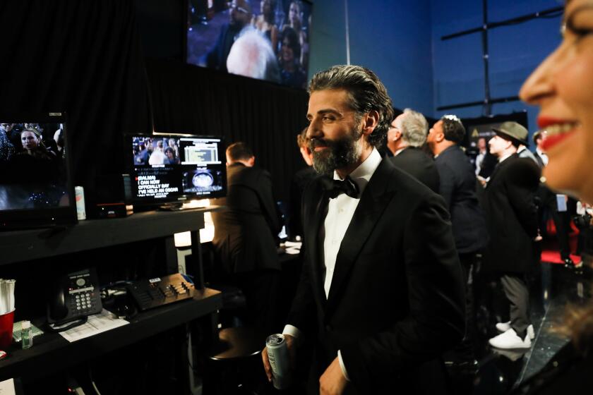 RESTRICTIONS: TNS AND WIRE SERVICES OUT. CALTIMES NEWSPAPERS AND WEBSITES ONLY. NO SALES. THIS PHOTO IS EMBARGOED UNTIL THE CONCLUSION OF THE ACADEMY AWARDS SHOW. IT CANNOT BE POSTED ON THE INTERNET OR ELSEWHERE UNTIL THE CONCLUSION OF THE ACADEMY AWARDS BROADCAST. HOLLYWOOD, CA – February 9, 2020: Oscar Isaac backstage at the 92nd Academy Awards on Sunday, February 9, 2020 at the Dolby Theatre at Hollywood & Highland Center in Hollywood, CA. (Al Seib / Los Angeles Times)