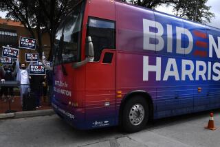 Democratic supporters cheer as the Biden-Harris campaign bus arrives at Vera Minter Park Wednesday Oct. 28, 2020 in Abilene, Texas. (Ronald W. Erdrich/The Abilene Reporter-News via AP)