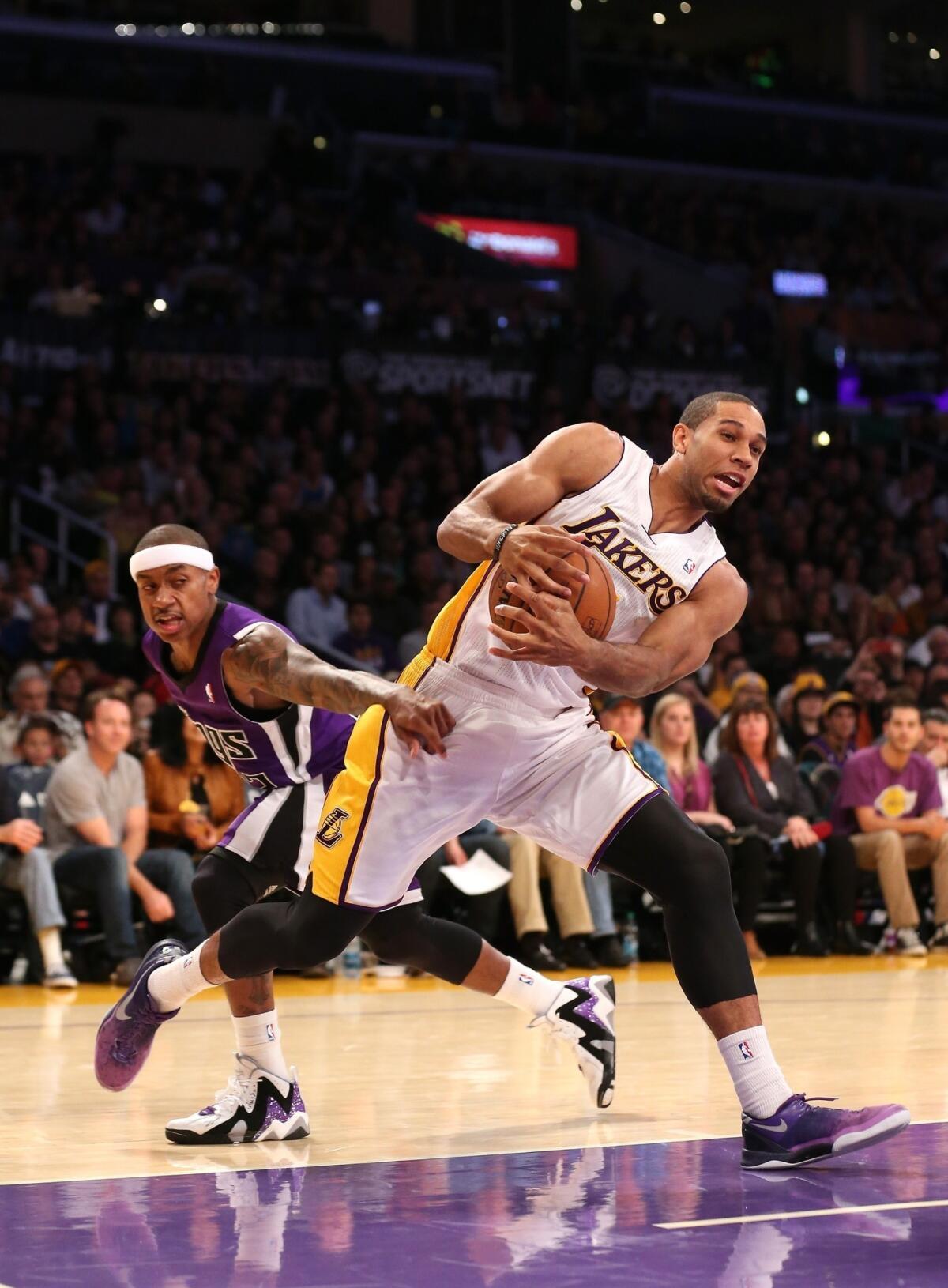 Lakers forward Xavier Henry drives to the basket during the team's 100-86 win over the Sacramento Kings on Sunday.