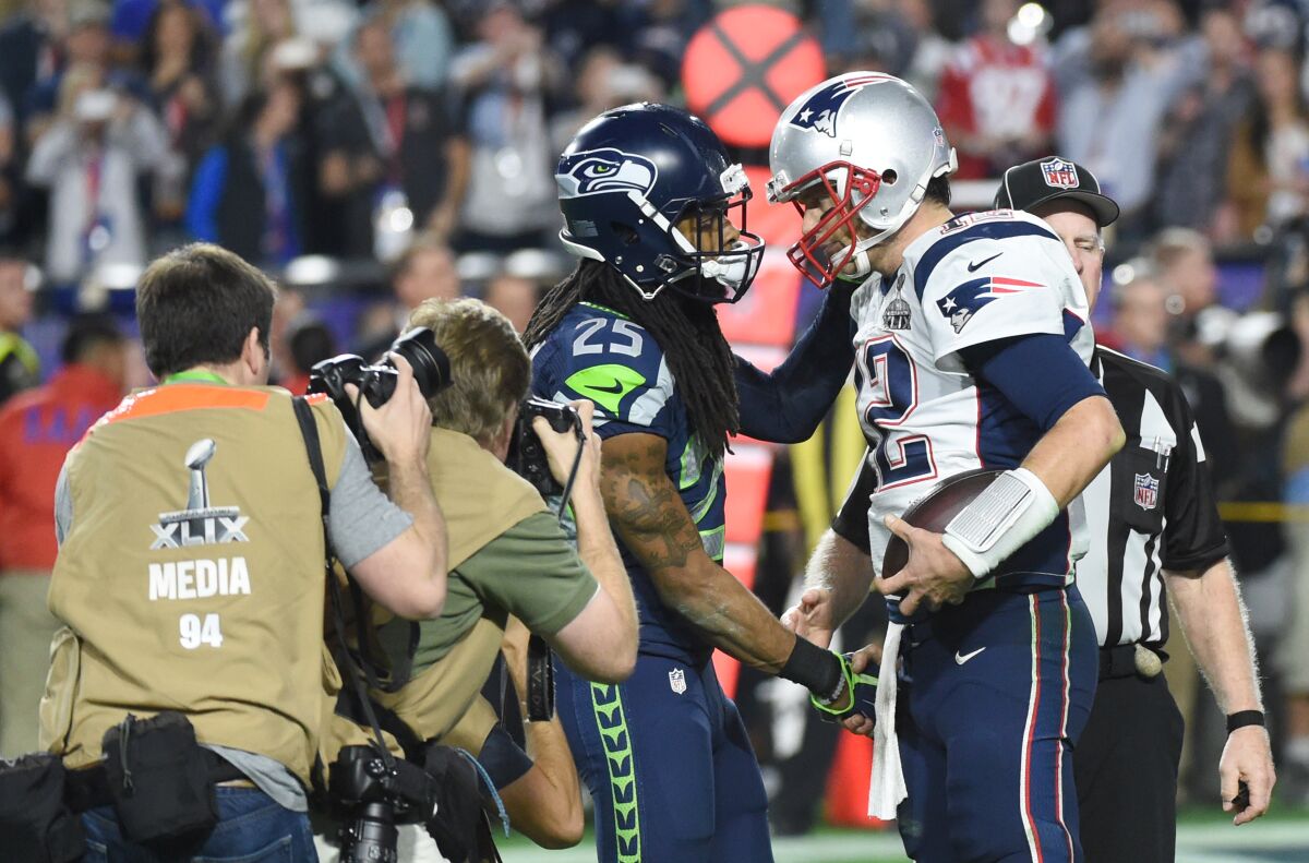 Patriots quarterback Tom Brady is congratulated by Seahawks cornerback Richard Sherman after winning the Super Bowl.