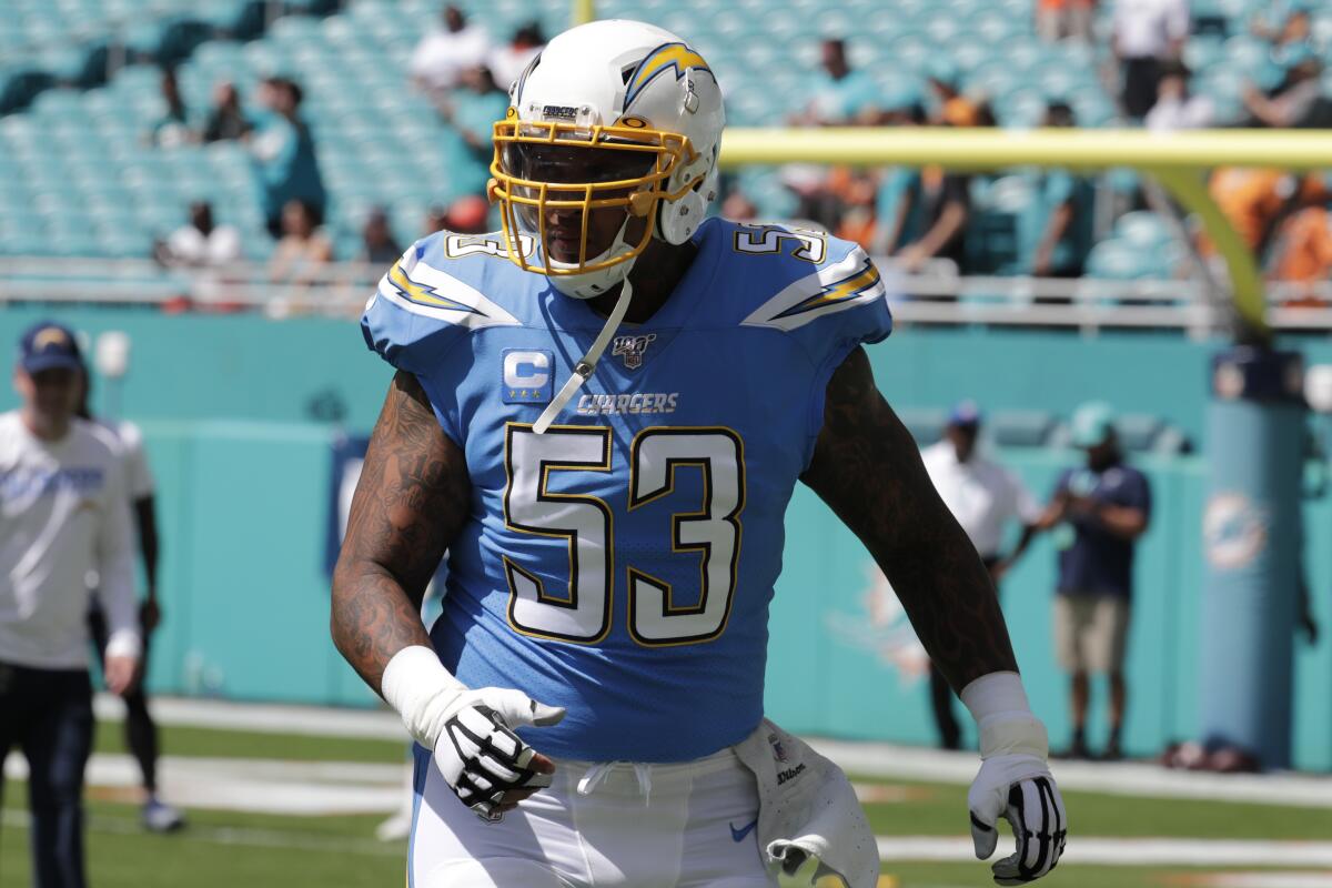 Chargers center Mike Pouncey warms up before a game in Miami last season.