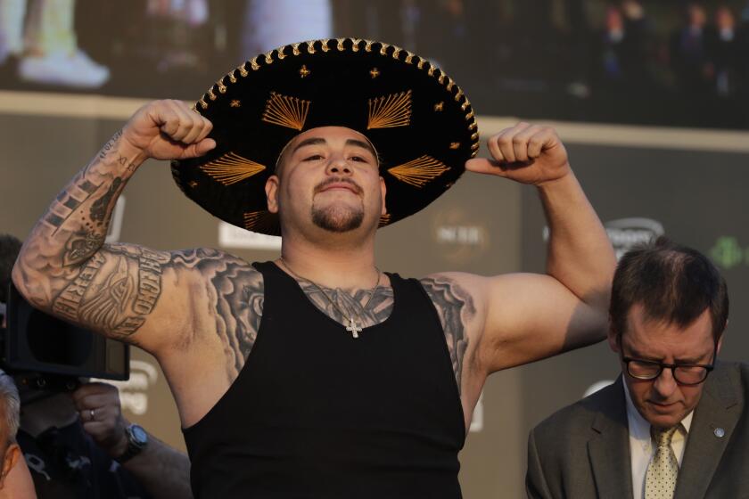 Heavyweight boxer Andy Ruiz Jr. of Mexico poses during a weigh-in at Faisaliah Center, in Riyadh, Saudi Arabia, Friday, Dec. 6, 2019. The first ever heavyweight title fight in the Middle East, has been called the "Clash on the Dunes." Will take place at the Diriyah Arena on Saturday. (AP Photo/Hassan Ammar)