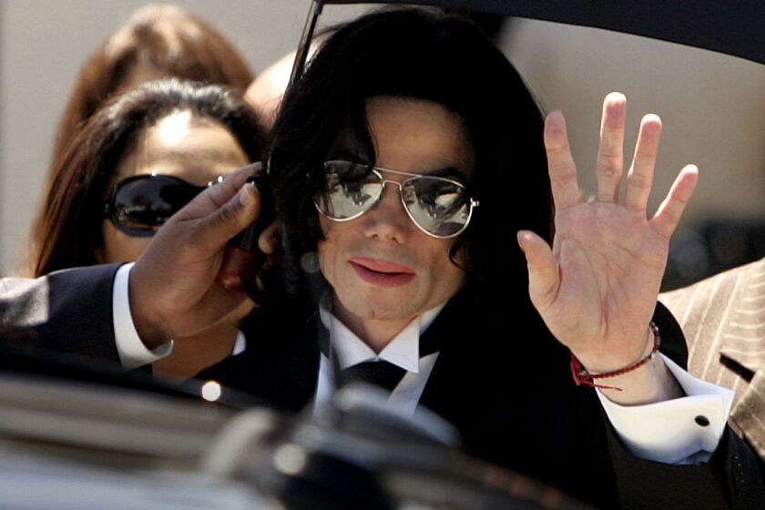Michael Jackson walks out of the Santa Maria Courthouse after being acquitted in a molestation case in 2005.