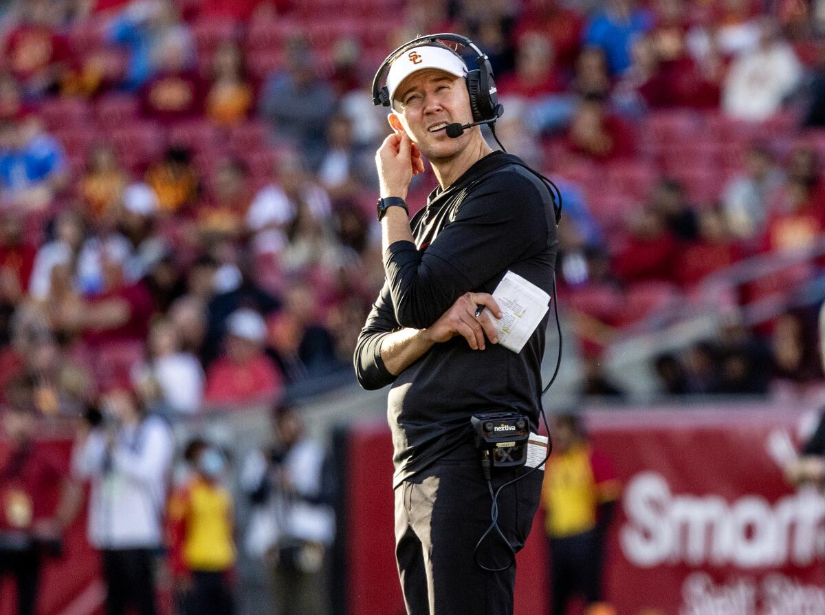 USC coach Lincoln Riley looks at the replay board during a 38-20 loss to rival UCLA at the Coliseum on Saturday. 