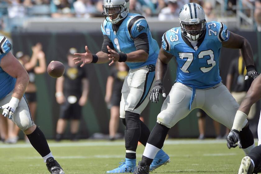 Panthers quarterback Cam Newton takes the snap during the second half of a game against the Jaguars on Sept. 13.