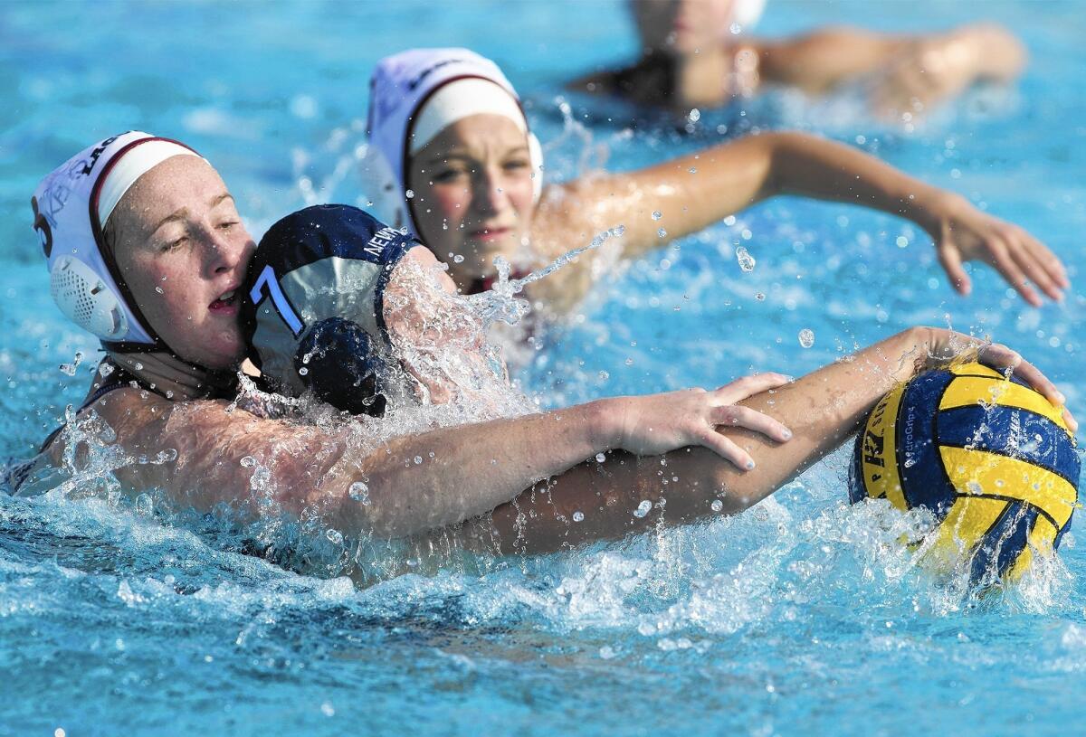 Newport Harbor High's Katie Kearns (7) battles inside against Laguna Beach's Haley Evans, left, during the first half in a nonleague game on Wednesday.