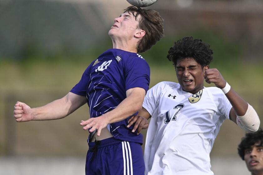 St. Augustine'a Ian Wagner, left, fights for a header with Del Norte's Vyaan Gautam during the second half of the CIF Open Division Championship game February, 24, 2024 in San Diego, Calif. (Photo by Denis Poroy)