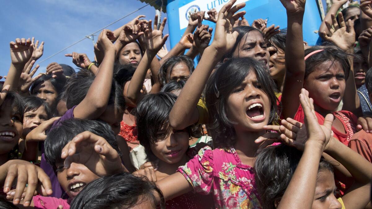 Rohingya refugee children shout slogans during a protest against the repatriation process at Unchiprang refugee camp in Bangladesh on Nov. 15.