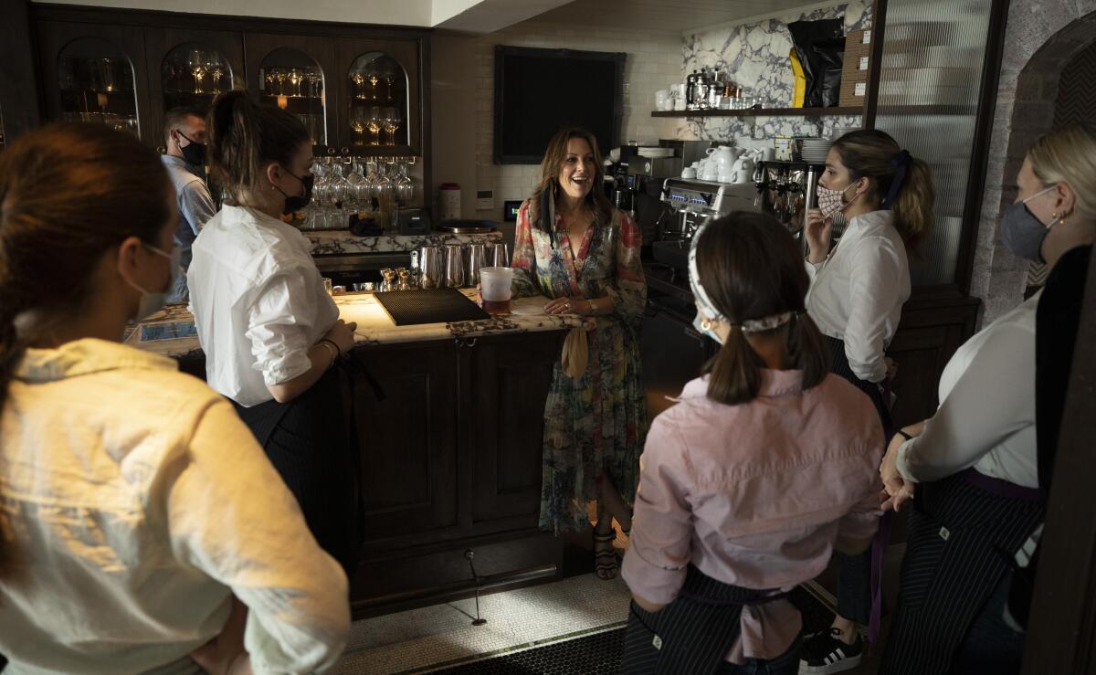 Dana Slatkin holds a pre-shift meeting with staff at Violet. 