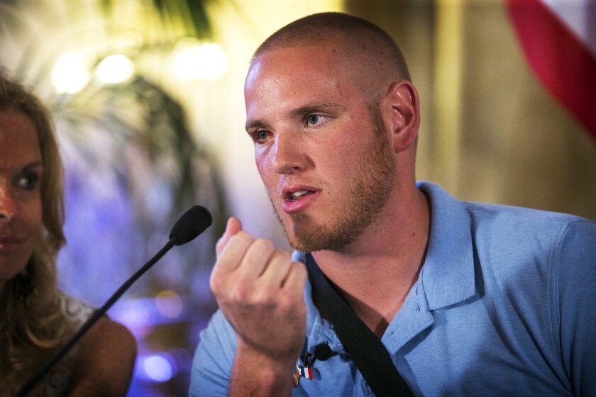 French train attack hero Spencer Stone, shown speaking to the media in August, was stabbed in a street fight in Sacramento last month. Police said Wednesday that a suspect in the stabbing has been arrested.